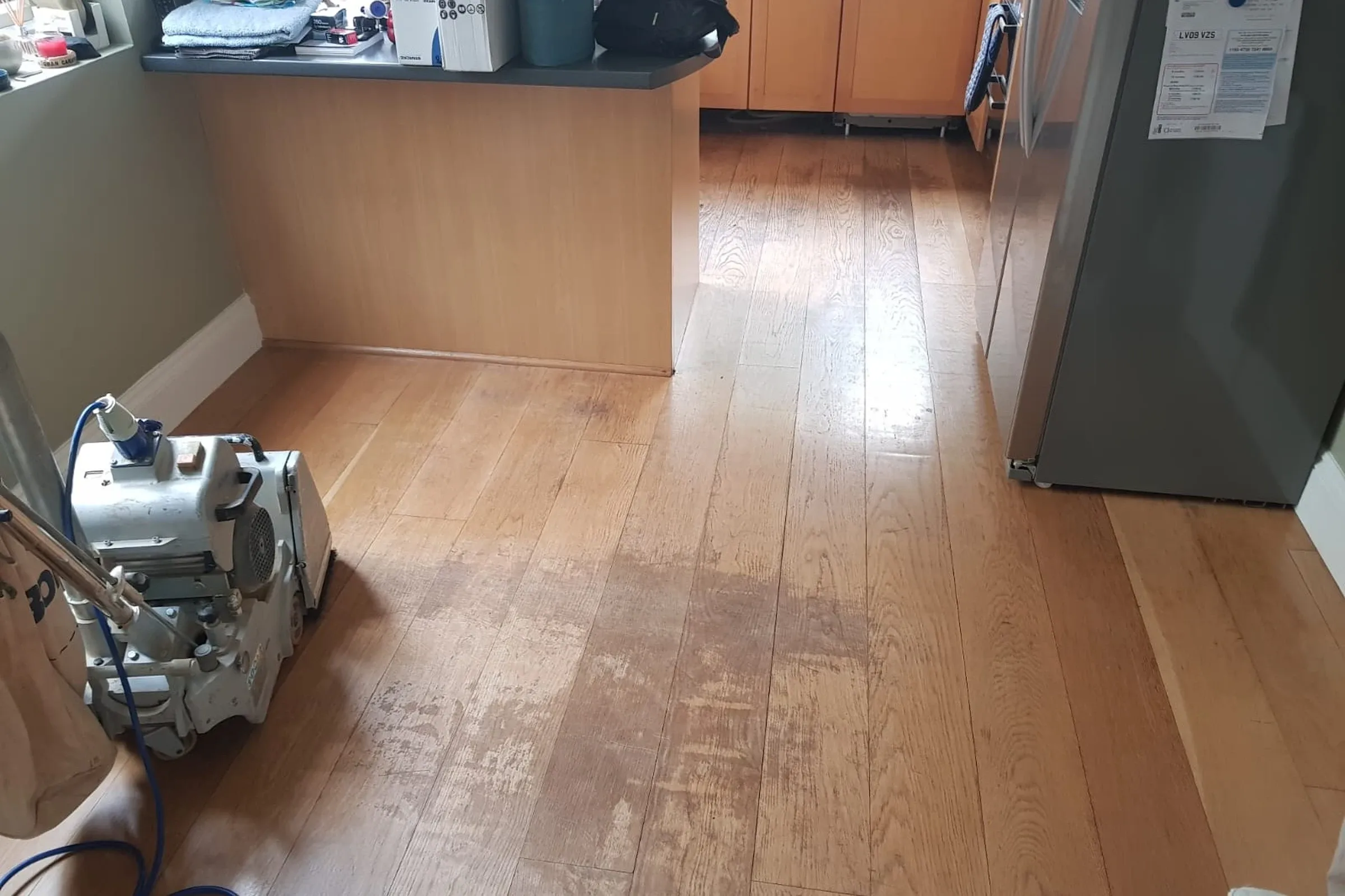 Damaged wooden floor before repair and staining