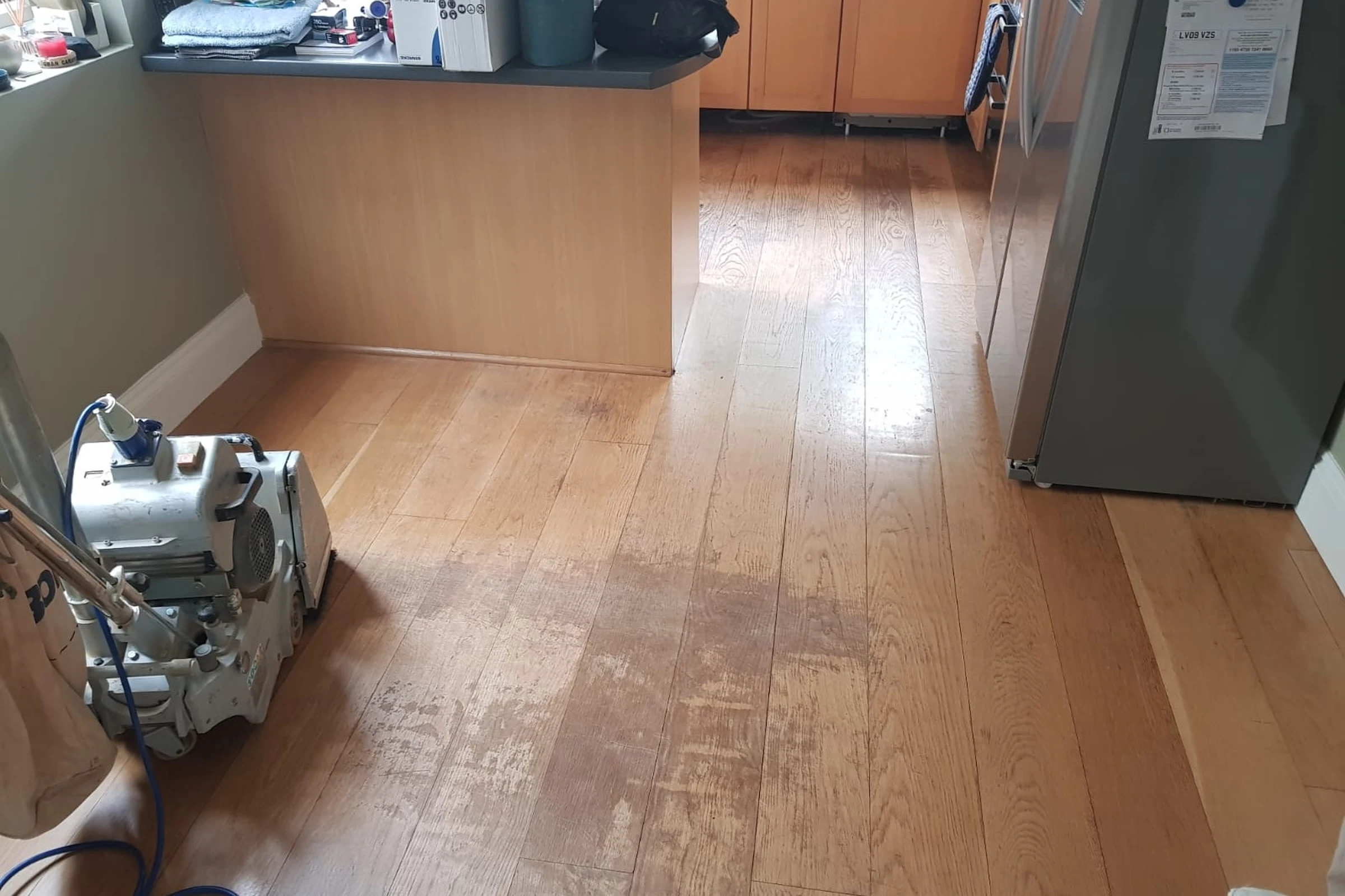 Damaged wooden floor before repair